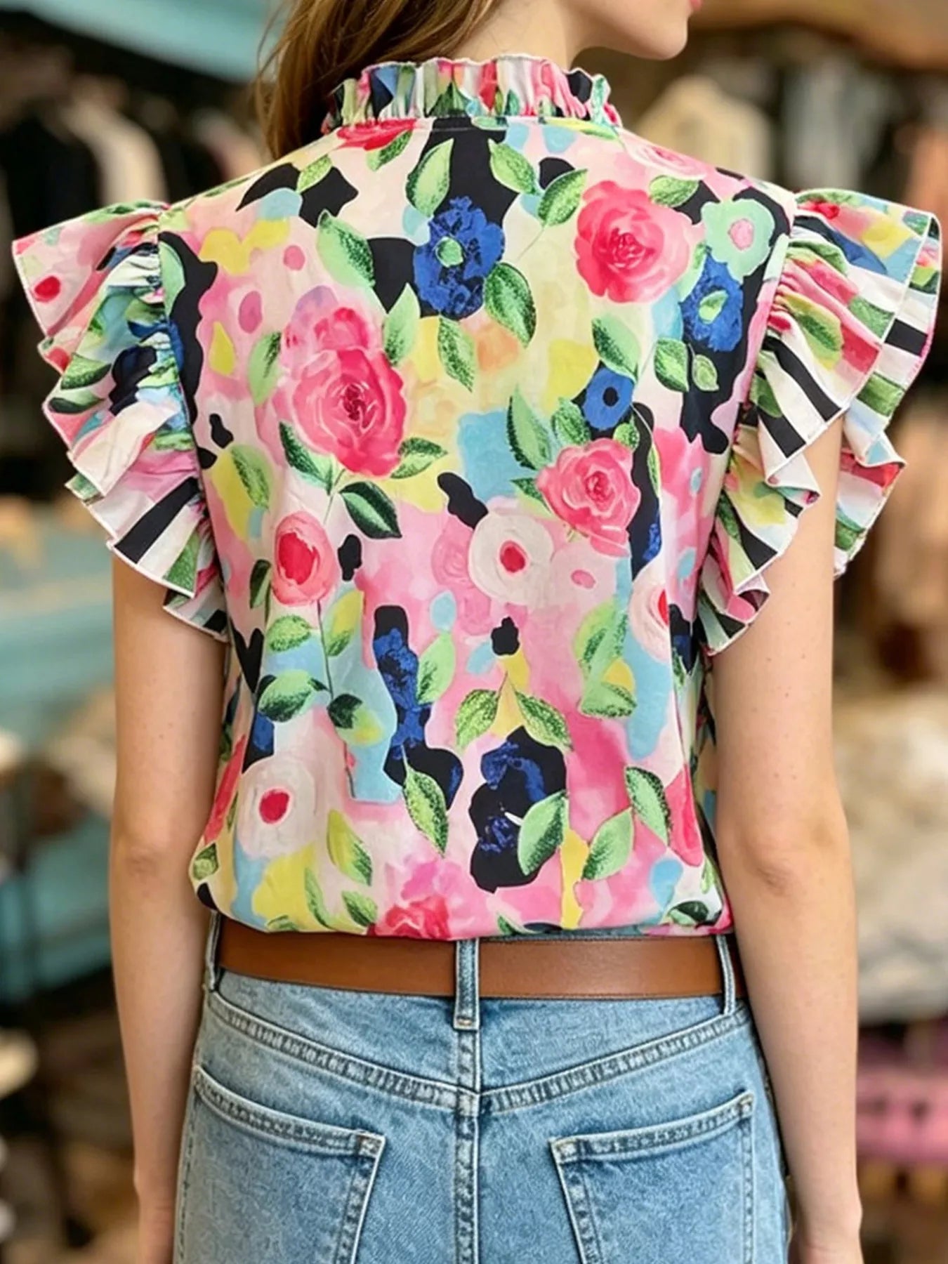 Printed ruffle sleeve blouse in 100% polyester with no stretch and machine washable care instructions