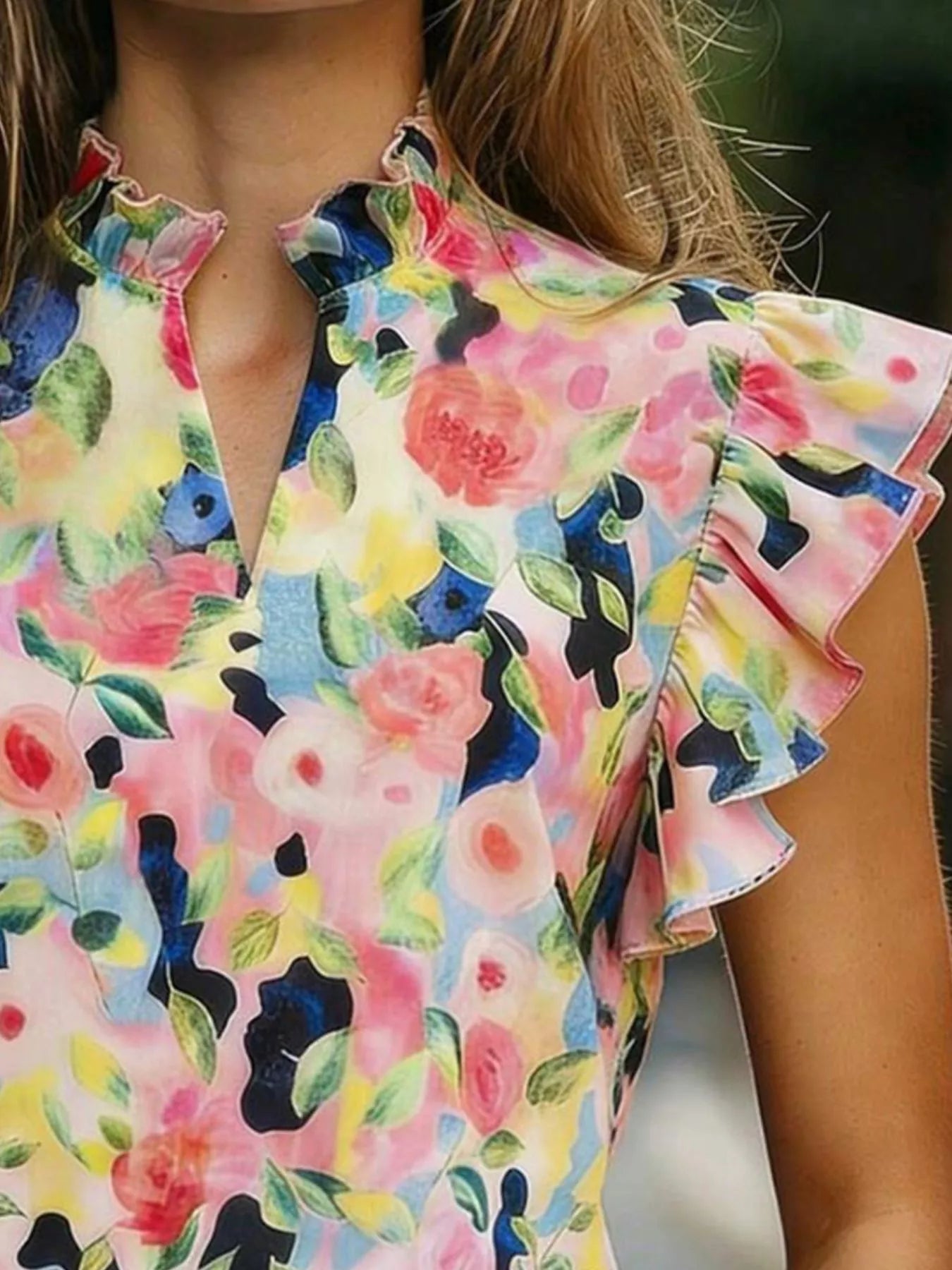 Printed ruffle sleeve blouse made of 100% polyester with no stretch and machine washable.